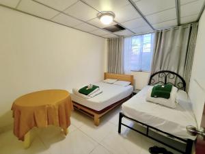 Postel nebo postele na pokoji v ubytování Departamento central Lin