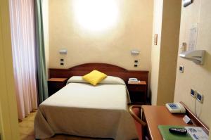 Postel nebo postele na pokoji v ubytování Hotel Button