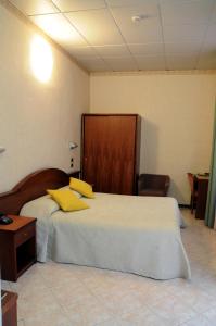 Postel nebo postele na pokoji v ubytování Hotel Button
