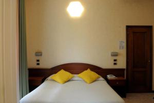 Postel nebo postele na pokoji v ubytování Hotel Button