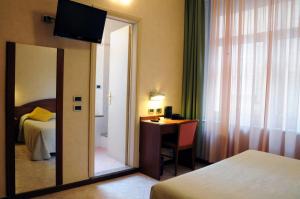 Postel nebo postele na pokoji v ubytování Hotel Button