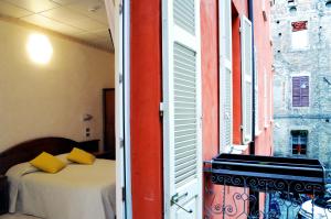 Postel nebo postele na pokoji v ubytování Hotel Button