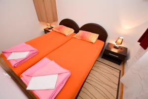 Ένα ή περισσότερα κρεβάτια σε δωμάτιο στο Marinero Apartments