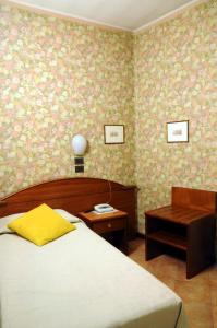 Postel nebo postele na pokoji v ubytování Hotel Button