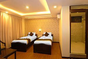 Voodi või voodid majutusasutuse Kathmandu Grand Hotel toas