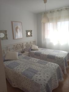 Posteľ alebo postele v izbe v ubytovaní BAHIA BLANCA