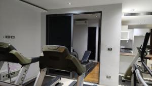 a room with a gym with a treadmill at Emerald Terrace Resort 2 bedrooms Panoramic Ocean View Top Floor in Patong Beach