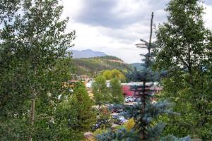 a view of a town through the trees at River Mountain Lodge in Breckenridge