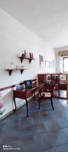 a room with a table and a bench and shelves at La Terrazza sul Mare in Torre Grande +47 photos