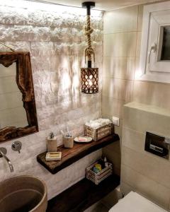 a bathroom with a sink and a mirror at Aelia House Chalkidiki in Fourka +34 photos