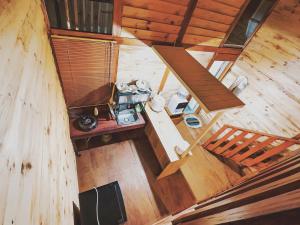 an overhead view of a room in a wooden building at miarzafa cabin house in Kejajar