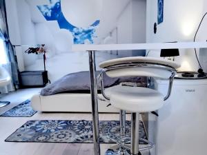 a room with two bar stools and a bed at My little paradise in Budapest