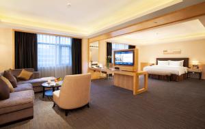 TV a/nebo společenská místnost v ubytování Yiho Hotel Xiamen Huli