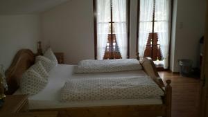 Postel nebo postele na pokoji v ubytování Gästehaus Obersulzberglehen