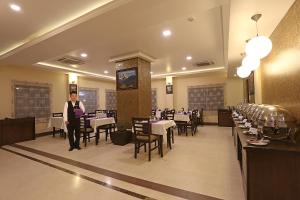 A restaurant or other place to eat at Hotel Harmika