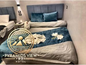Krevet ili kreveti u jedinici u objektu Pyramids View R Z Hotel