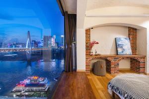 Katil atau katil-katil dalam bilik di 重庆暖余江景民宿 Chongqing Nuanyu River View Hotel