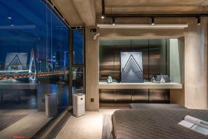 Katil atau katil-katil dalam bilik di 重庆暖余江景民宿 Chongqing Nuanyu River View Hotel