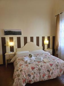 Postel nebo postele na pokoji v ubytování Albergo Etruria