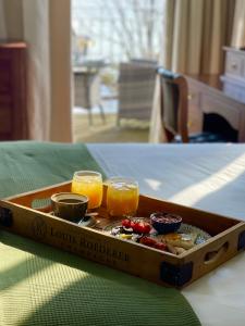 a tray of food with two glasses of orange juice at The Wellington Hotel in Ventnor