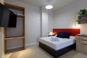 Postel nebo postele na pokoji v ubytování Osito Hub - Colomer