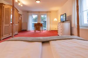 Ein Bett oder Betten in einem Zimmer der Unterkunft Hotel Antoniushütte