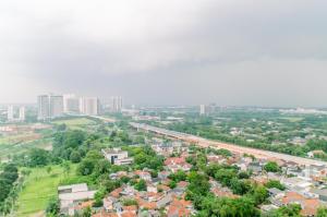 an aerial view of a city with tall buildings at Comfort and Homey Studio at Parkland Avenue Apartment By Travelio in Tangerang