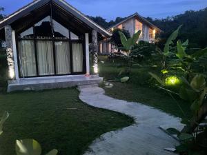 a house with a walkway in front of it at Villa Neka in Luk