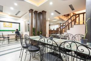 Een restaurant of ander eetgelegenheid bij Greatwall International Hotel