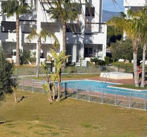 an empty swimming pool in front of a building at Casa Helen Las Terrazas de la Torre - Blue Sky Property in Murcia