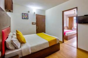 Letto o letti in una camera di Hotel Greenfields