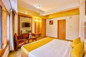 Letto o letti in una camera di Hotel Greenfields