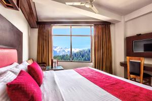 Letto o letti in una camera di Hotel Greenfields