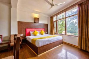 Letto o letti in una camera di Hotel Greenfields