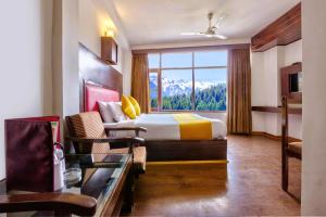 Letto o letti in una camera di Hotel Greenfields