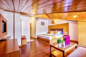 Letto o letti in una camera di Hotel Greenfields