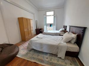 Postel nebo postele na pokoji v ubytování Ahllan Hostel For Men onlyغرف خاصة للرجال فقط 仅限男士 女士不允许