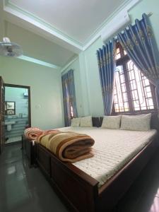 Postel nebo postele na pokoji v ubytování Homestay Anh Đào