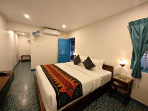 Voodi või voodid majutusasutuse Ibex Resorts, Coimbatore Kakarla toas