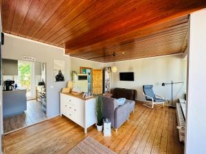 a living room with a couch and a table at Strandhaus Graalibu in Graal-Müritz