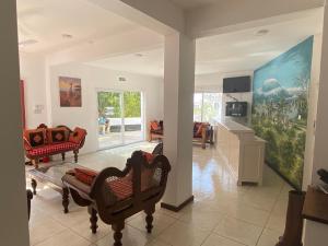 a living room with two chairs and a couch at The Beach House by Maasai in Mombasa
