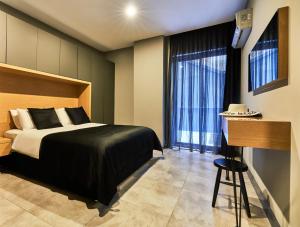 a bedroom with a bed and a large window at Loft 1502 in Antalya +33 photos