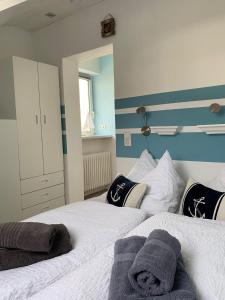 Ένα ή περισσότερα κρεβάτια σε δωμάτιο στο Wohnung-Amrum-Haus-Duenengras
