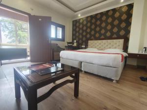 Postel nebo postele na pokoji v ubytování Hotel Himland East Drive In