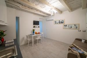 a living room with a table and a couch at MagentA NesT - Loft&Charme in Brescia