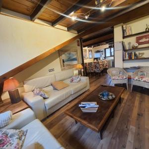 a living room with a couch and a coffee table at El Arcángel de Santillana del Mar in Santillana del Mar