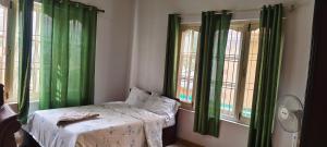 Postel nebo postele na pokoji v ubytování Heritage View Homestay
