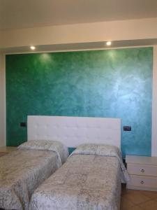 A bed or beds in a room at Il Casale Della Fornace