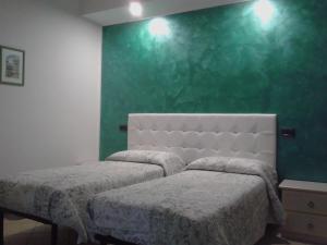 A bed or beds in a room at Il Casale Della Fornace