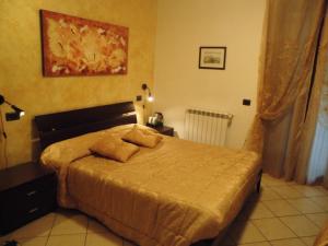 A bed or beds in a room at Il Casale Della Fornace